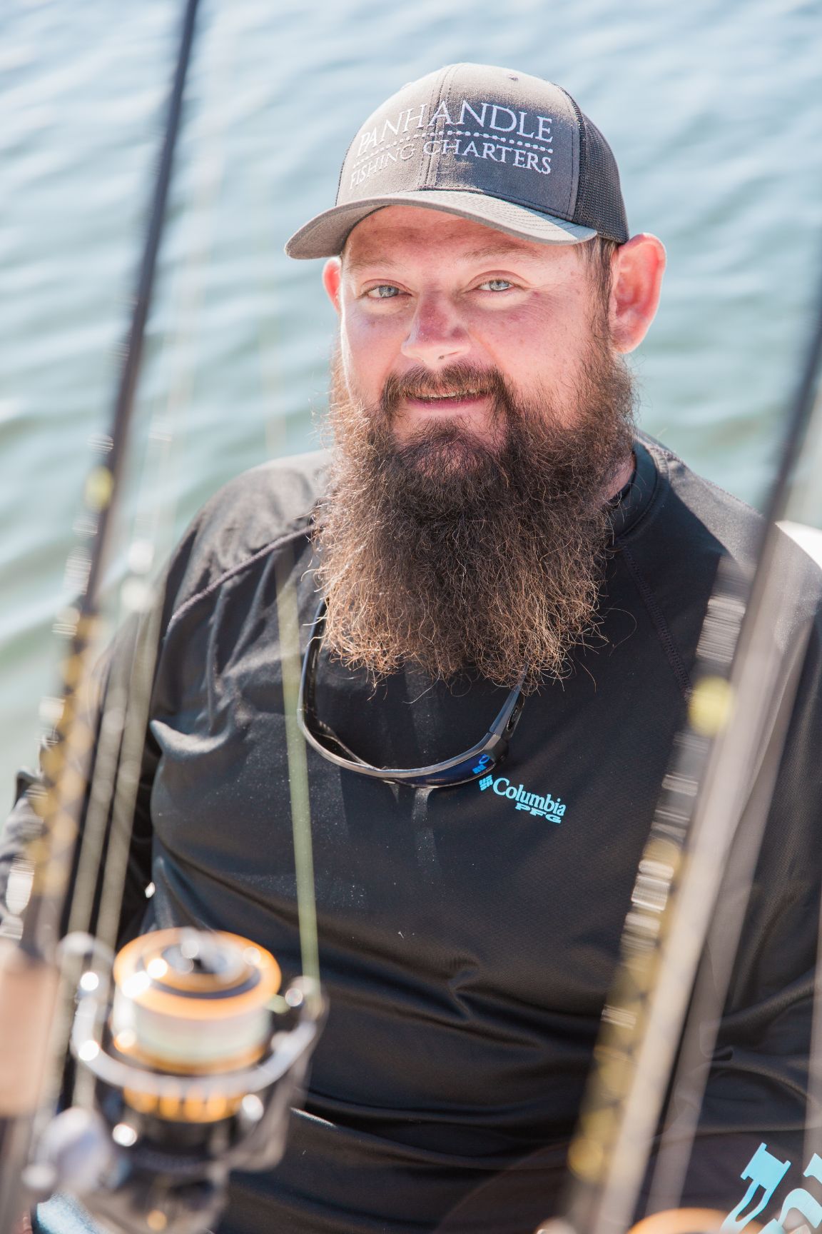 Captain Taylor with Panhandle Fishing Charters takes time to pose while scouting for prime fishing locations.